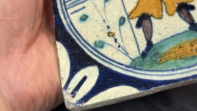 A polychrome Dutch Delft maiolica 'soldier' medallion tile, late 16th C.