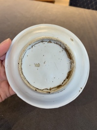 Four Chinese white-glazed saucers and three bowls, Yuan/Ming