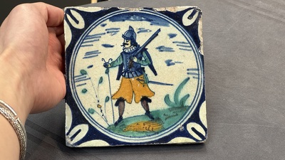 A polychrome Dutch Delft maiolica 'soldier' medallion tile, late 16th C.