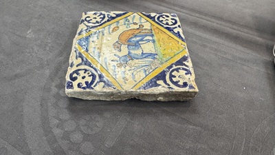 A polychrome Dutch Delft maiolica 'mating dogs' diamond tile, late 16th C.