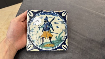 A polychrome Dutch Delft maiolica 'soldier' medallion tile, late 16th C.