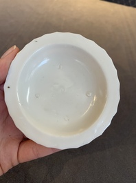 Four Chinese white-glazed saucers and three bowls, Yuan/Ming