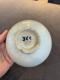 Four Chinese white-glazed saucers and three bowls, Yuan/Ming