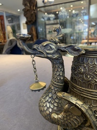A brass griffin-form aquamanile, Germany, 19th C.