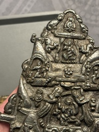 Four Tibetan bronze and wooden phurbas, a 'kapala' or skull-bowl and two silver ornaments, 19th C.