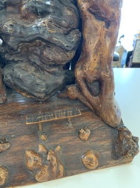 A Chinese carved wooden group and a natural root sculpture, 20th C.