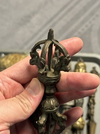 Four Tibetan bronze and wooden phurbas, a 'kapala' or skull-bowl and two silver ornaments, 19th C.