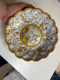 A polychrome Dutch maiolica 'putto and dog' plate, Verstraeten workshop, Haarlem, 17th C.