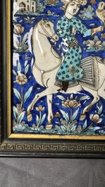 A rectangular Qajar relief-moulded tile with a prince on horseback, Iran, 19th C.