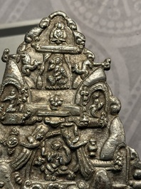 Four Tibetan bronze and wooden phurbas, a 'kapala' or skull-bowl and two silver ornaments, 19th C.