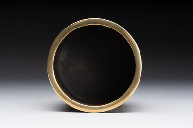 A Chinese bronze cylindrical tripod censer, Xuande mark, 18th C.