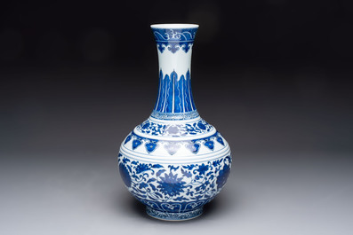 A Chinese blue and white 'flower scroll' bottle vase, Xuantong mark, 20th C.