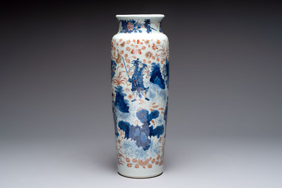 A Chinese gilt and iron-red decorated blue and white rouleau vase with figural design, 19/20th C.