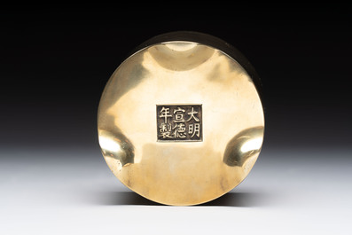 A Chinese bronze cylindrical tripod censer, Xuande mark, 18th C.