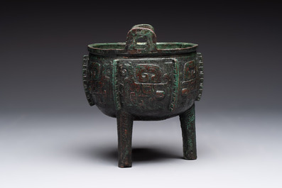 A Chinese archaic bronze tripod food vessel with 'taotie' design, 'ding 鼎', Western Zhou