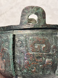 A Chinese archaic bronze tripod food vessel with 'taotie' design, 'ding 鼎', Western Zhou