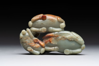 A Chinese celadon jade group of three goats on wooden stand, 19/20th C.
