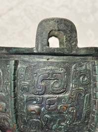 A Chinese archaic bronze tripod food vessel with 'taotie' design, 'ding 鼎', Western Zhou