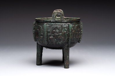 A Chinese archaic bronze tripod food vessel with 'taotie' design, 'ding 鼎', Western Zhou