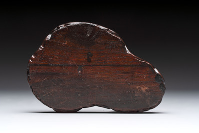 A Chinese celadon jade group of three goats on wooden stand, 19/20th C.