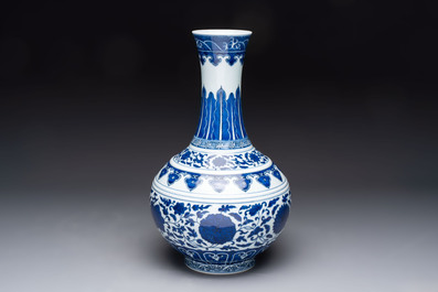 A Chinese blue and white 'flower scroll' bottle vase, Xuantong mark, 20th C.