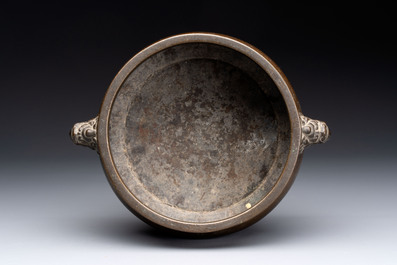 Two Chinese bronze censers with lion-form handles, Zi Sun Bao Zhi 子孫保之 mark, 19th C.