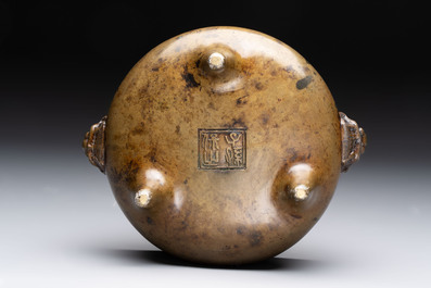 Two Chinese bronze censers with lion-form handles, Zi Sun Bao Zhi 子孫保之 mark, 19th C.