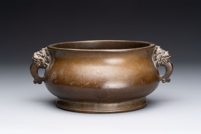 Two Chinese bronze censers with lion-form handles, Zi Sun Bao Zhi 子孫保之 mark, 19th C.