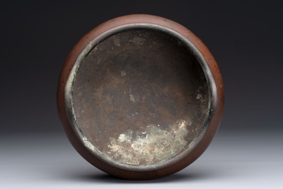 A Chinese bronze tripod censer, Xuande mark, 17/18th C.