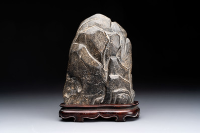 A Chinese Lingbi stone scholar's rock on wooden stand, Yun Tai 雲台 mark, 19/20th C.