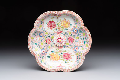 A Chinese famille rose moulded teapot and stand with floral design, Yongzheng/Qianlong