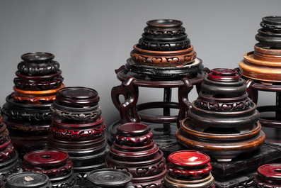 A collection of 100 Chinese wooden stands, 19/20th C.
