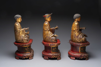 A set of three Chinese or Vietnamese gilt-lacquered wooden sculptures of Buddha, 18/19th C.