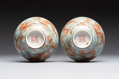 A pair of Chinese gilt and iron-red decorated 'dragons on waves' bowls, Jiaqing mark, 19th C.