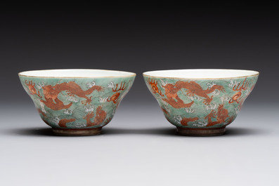 A pair of Chinese gilt and iron-red decorated 'dragons on waves' bowls, Jiaqing mark, 19th C.