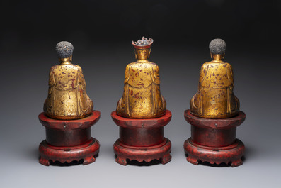 A set of three Chinese or Vietnamese gilt-lacquered wooden sculptures of Buddha, 18/19th C.