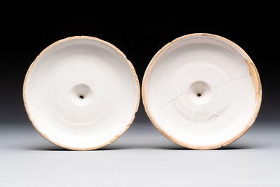 A pair of polychrome French faience candlesticks, 18th C.