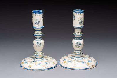 A pair of polychrome French faience candlesticks, 18th C.