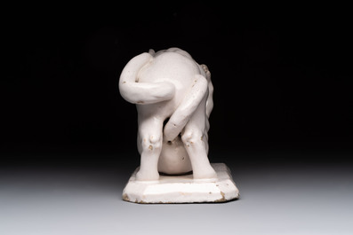 A rare white-glazed Delftware group of two fighting felines, early 18th C.