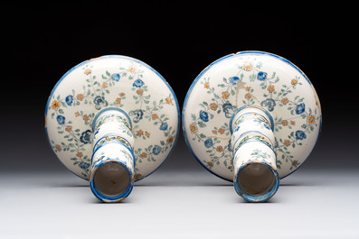 A pair of polychrome French faience candlesticks, 18th C.