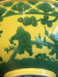 An imperial Chinese green-enamelled yellow-ground 'playing boys' bowl, Yongzheng mark and of the period