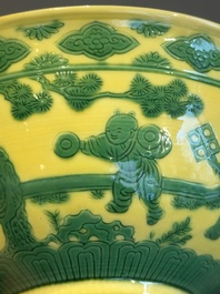 An imperial Chinese green-enamelled yellow-ground 'playing boys' bowl, Yongzheng mark and of the period