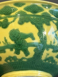 An imperial Chinese green-enamelled yellow-ground 'playing boys' bowl, Yongzheng mark and of the period