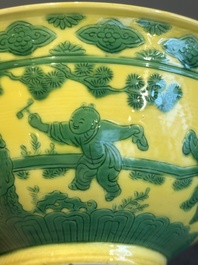 An imperial Chinese green-enamelled yellow-ground 'playing boys' bowl, Yongzheng mark and of the period