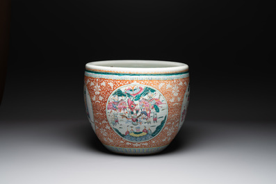 A large Chinese famille rose coral-red-ground fish bowl with narrative design, 19th C.