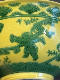 An imperial Chinese green-enamelled yellow-ground 'playing boys' bowl, Yongzheng mark and of the period