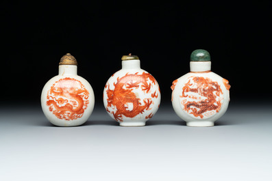 A diverse group of 12 Chinese snuff bottles and three covered seal paste boxes, Qianlong and Daoguang marks, 19th C.