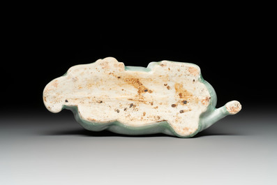 A pair of Chinese polychrome lions and a celadon-glazed goat, 20th C.