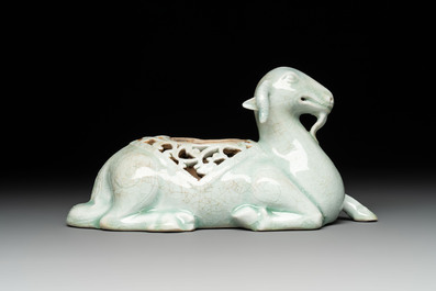 A pair of Chinese polychrome lions and a celadon-glazed goat, 20th C.