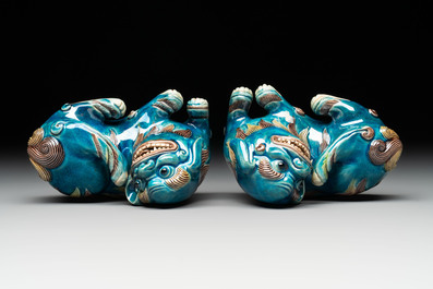 A pair of Chinese polychrome lions and a celadon-glazed goat, 20th C.
